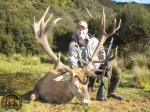Photo of Dr. Brad Black with his Free-Range Red Stag Hunting New Zealand. Red Stag hunting in New Zealand. Red Stag hunts in New Zealand hunts