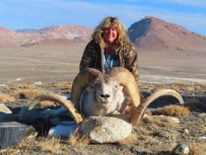 Hunting Consortium client with her Marco Polo Sheep Hunting trophy from Tajikistan.