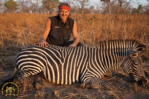 Our client, Jim Shockey with his Zebra. Zebra hunting in Africa. Zebra hunts in Africa.