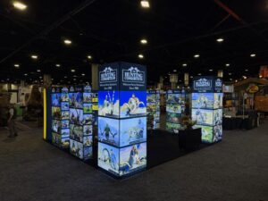 Dallas Safari Club 2026 Hunting Consortium exhibit floor displaying illuminated panels of global big game hunting trophies and destinations. DSC 2026.