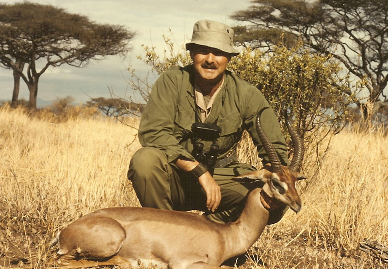 Bob Kern with a harvested African antelope during an early safari, reflecting decades of international hunting field experience.