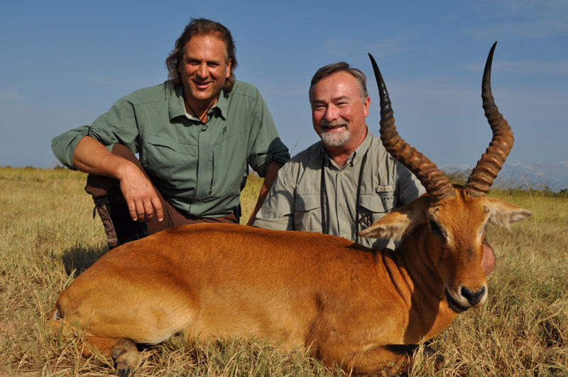 Jim Shockey and Bob Kern with a harvested antelope during an African hunting safari.